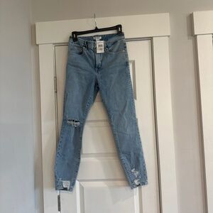 Good America fitted distressed bottoms jeans